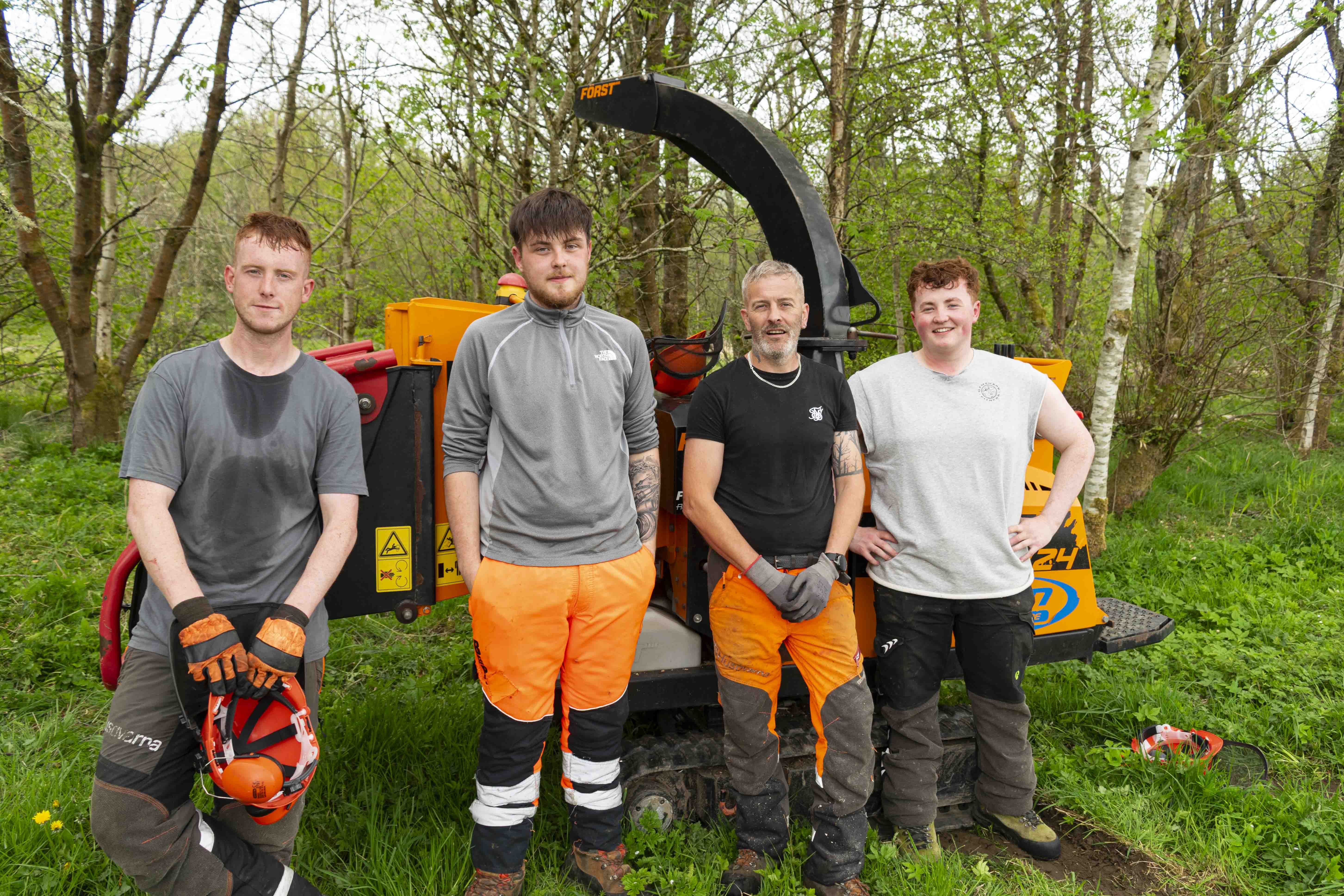 Apprentices Kieran Stevenson, Eoghan McChesney, tutor Mark McDicken and apprentice Jack Fraser at Patna Community Woodland.